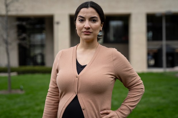 Angela Betancourt-Ciprian, clinical assistant professor in Hispanic and Italian studies, poses for a portrait during the Day of Action for Higher Ed at the UIC University Hall lawn on April 16, 2025. (E. Jason Wambsgans/Chicago Tribune)