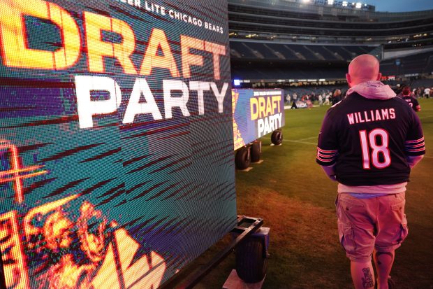 A fan wearing a Caleb Williams jersey attends the Bears draft party on April 24, 2025, at Soldier Field. (Chris Sweda/Chicago Tribune)
