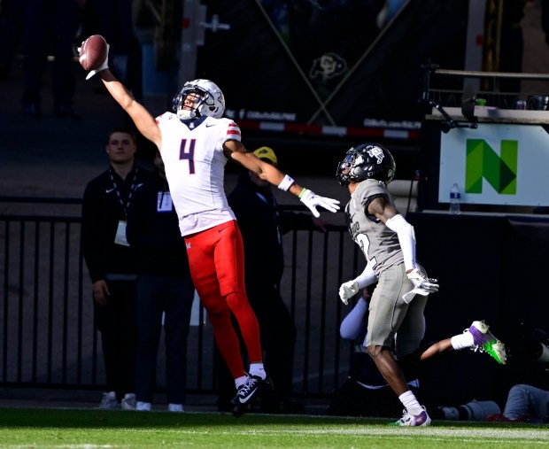 Arizona wide receiver Tetairoa McMillan makes a one-handed catch for a touchdown against Colorado cornerback Travis Hunter on Nov. 11, 2023. (Andy Cross/The Denver Post)