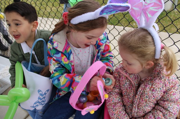 Adrian Rondon, age 5, Cecilia Lopresti, age 6, and Sara Lopresti, age 2, of Lake Forest, during Egg Hunt Eggstravaganza 2025, hosted by Lake Forest Parks and Recreation on Saturday, April 19. (Gina Grillo/ for the Pioneer Press)