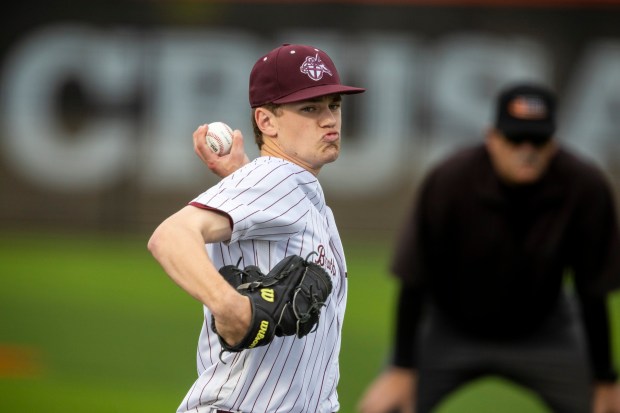 Brother Rice's Danny Sheehan (12) delivers a pitch against Lincoln-Way East during a nonconference game in Chicago on Tuesday, April 22, 2025. (Vincent D. Johnson / for the Daily Southtown)