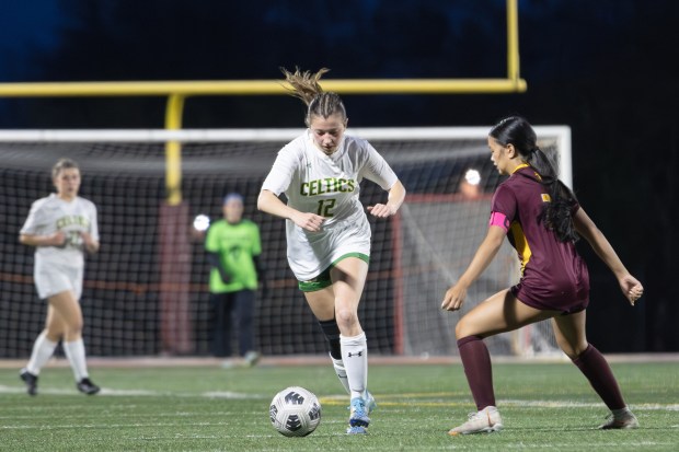 Providence's Maggie Wolniakowski (12) dribbles down field against Montini during a CCS game in Lombard on Tuesday April 22, 2025. (Troy Stolt for the Daily Southtown)