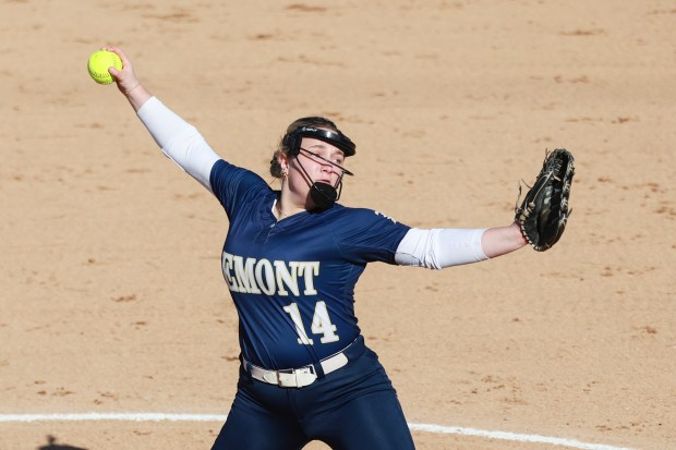 Lemont's Sydney Kibbon (14) throws a pitch against Tinley Park during an SSC game in Lemont on Tuesday April 8, 2025. (Troy Stolt for the Daily Southtown)