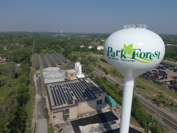 The Park Forest water tower stands tall beside the village's water treatment facility and expansive solar panel array on Wednesday, June 7, 2023. (Village of Park Forest)