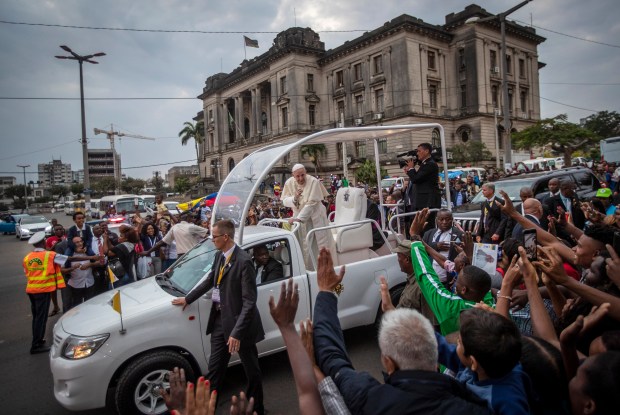 Pope Francis waves to wellwishers as he leaves after a meeting at the Cathedral of the Immaculate Conception in the capital Maputo, Mozambique, Sept. 5, 2019. (Ben Curtis/AP)
