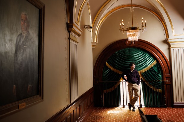 Brady Burden, who is with the Illinois Legislative Staff Association, stands in the gallery above the House floor at the Illinois State Capitol, April 14, 2025, in Springfield. He said low staffing levels are concerning. (Armando L. Sanchez/Chicago Tribune)