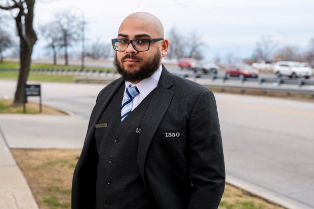 Doorman Julian Fuentes stands outside the building he works in the 1500 block of North DuSable Lake Shore Drive, April 9, 2025. (Eileen T. Meslar/Chicago Tribune)