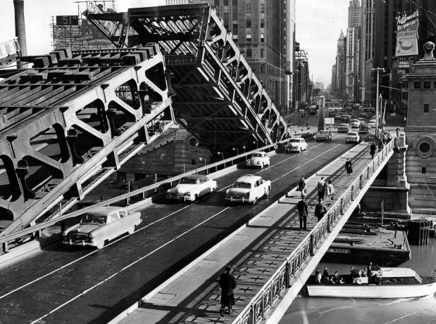 A view of the Michigan Avenue Bridge looking south, after it was split down the middle on May 5, 1957, 37 years after it was erected. The west half of the bridge now takes traffic in both directions while the east half is raised for repair work. When the project on the east half was finished, it switched sides. (William Bender/Chicago Tribune)
