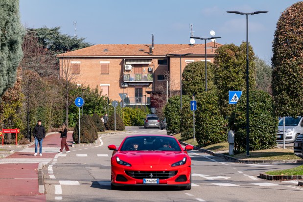 A Ferrari is taken for a test drive on the streets of Maranello, Italy, in Feb. 2025. Lamborghini, Ferrari, Maserati and the high-end motorcycle brand Ducati are just the most recognizable names among the many, many manufacturers that come together in what is sometimes called Italy's "Motor Valley." (Federico Borella/The New York Times)