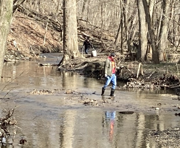 This volunteer got into the river to extract trash. (Steve Sadin/For the Lake County News-Sun)