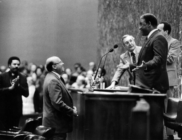 Mayor Harold Washington acknowledges an ovation from supporters after his introduction on May 2, 1983, at his first council meeting at City Hall. He adjourned the meeting shortly afterward. (Ernie Cox Jr./Chicago Tribune)