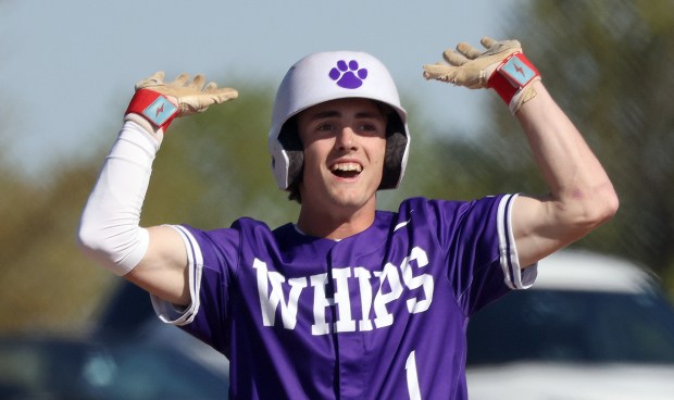 Hampshire's Calen Scheider (1)reacts to cheers from teammates after his first inning triple against Burlington Central during a Fox Valley Conference game in Burlington on Friday, May 9, 2025.(H. Rick Bamman / The Beacon-News)