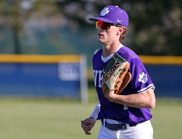 Hampshire's Calen Scheider (1) returns to the dugout in the sixth inning against Burlington Central during a Fox Valley Conference game in Burlington on Friday, May 9, 2025.(H. Rick Bamman / The Beacon-News)