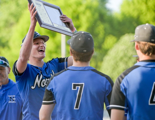 St. Charles North pitcher Keaton Reinke (6) celebrates the conference championship win over Geneva with his teammates on Friday, May 23, 2025. (Mark Black / for the Beacon-News)