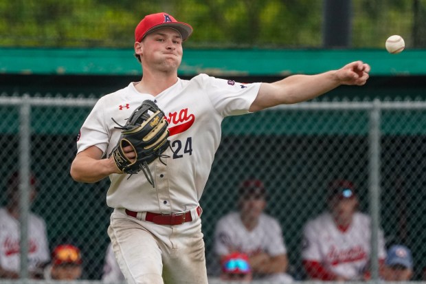West Aurora's Zach Toma (24) fields a grounder and throws to first for an out against Neuqua Valley during a Class 4A Waubonsie Valley Regional semifinal game at Waubonsie Valley High School in Aurora on Wednesday, May 28, 2025. (Sean King / for The Beacon-News)
