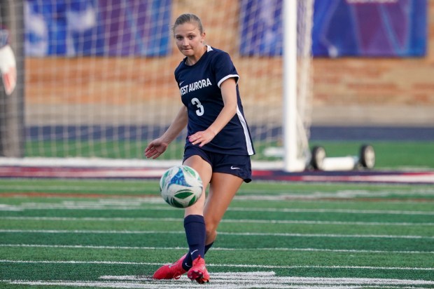 West Aurora's Baylee Geni (3) clears the ball during a Upstate Eight Conference soccer match against Elgin at West Aurora High School on Tuesday, May 6, 2025. (Sean King / for The Beacon-News)