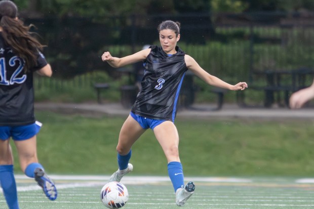 St. Charles North's Aubri Magana (3) passes the ball against Wheaton Warrenville South during the Class 3A Glenbard West Sectional final in Glen Ellyn on Friday, May 30, 2025. (Troy Stolt for the Beacon News)