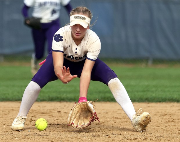 Hampshire's Bria Riebel (1) picks up a grounder by Geneva's Kat Cerwin in the fifth inning during a nonconference game in Geneva on Thursday, May 22, 2025. H. Rick Bamman / For The Beacon-News