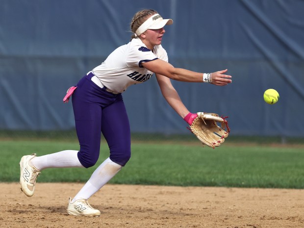 Hampshire's Bria Riebel (1) tosses a grounder by Geneva's Summer Ayersmann to second base for the first half of a double play in the fourth inning during a nonconference game in Geneva on Thursday, May 22, 2025. H. Rick Bamman / For The Beacon-News
