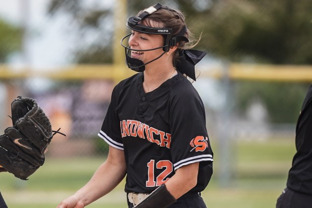 Sandwich pitcher Brooklyn Marks (12) smiles after recording a victory over Newark in a nonconference game at Sandwich High School on Saturday, May 17, 2025. (Sean King / for The Beacon-News)