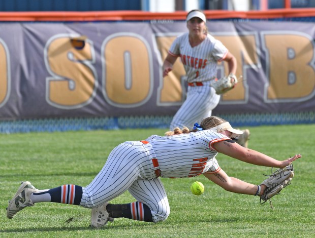 Oswego's Natalie Muellner just misses a diving attempt of a sinking line drive hit by a Yorkville batter during a game on Thursday, May 15, 2025 in Oswego.(Jon Cunningham/for The Beacon-News)