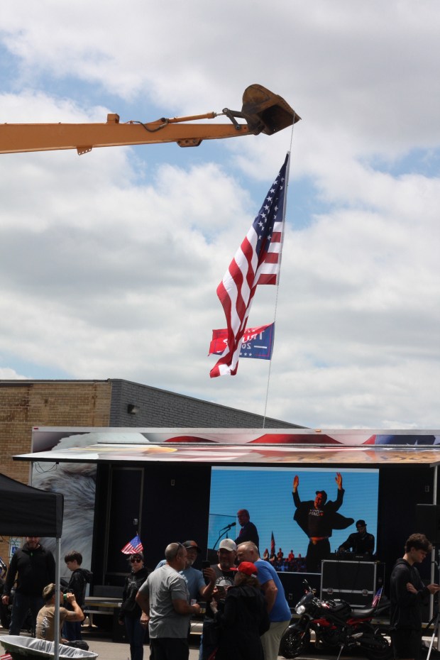 Pro-Trump counter-protesters gather across the street from the Hands Across Chicagoland protest in Lisle on May 18, 2025. (Molly Morrow / The Beacon-News)