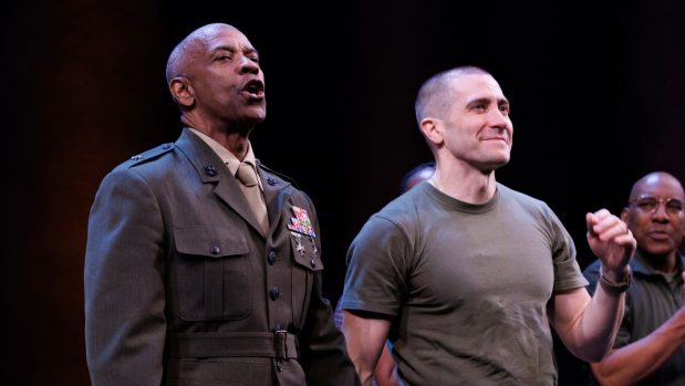 Denzel Washington, left, and Jake Gyllenhaal participate in the curtain call for the Broadway opening night of William Shakespeare's "Othello" at the Barrymore Theatre.
