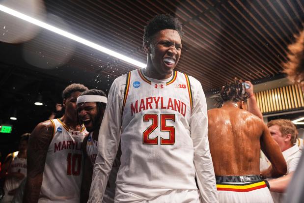 Maryland center Derik Queen celebrates with teammates after making the winning basket against Colorado State in the second round of the NCAA Tournament on March 23, 2025, in Seattle. (AP Photo/Lindsey Wasson)