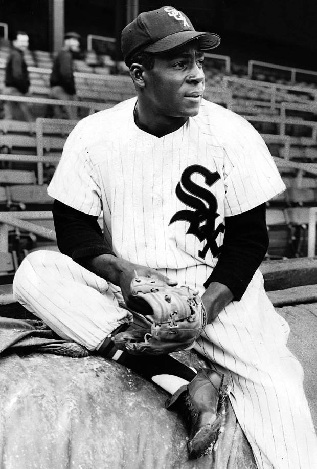 White Sox left fielder Minnie Minoso relaxes at Comiskey Park on April 27, 1956.