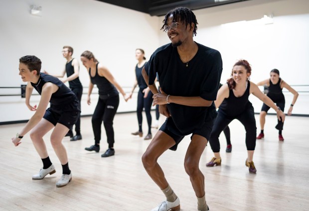 Sterling Harris (center) leads a rehearsal of "Chicago Tap Theatre at 20: Tempo, Rhythm and Time" on Feb. 6, 2023, at the Visceral Dance Center in Chicago. (Brian Cassella/Chicago Tribune)