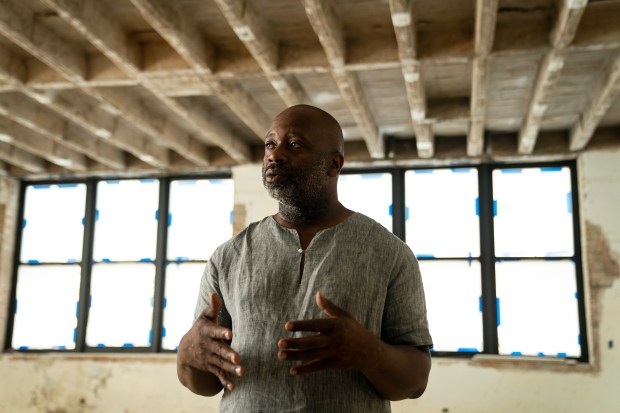 Theaster Gates in the formerly abandoned St. Laurence elementary school in the Grand Crossing neighborhood, being transformed by Gates and his Rebuild Foundation, on Sep. 2, 2021. (E. Jason Wambsgans/Chicago Tribune)