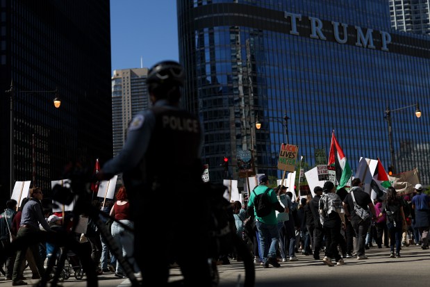 Protesters march toward Trump Tower after a Chicago Alliance Against Racist and Political Repression demonstration at Federal Plaza on May 25, 2025, to mark the five-year anniversary of George Floyd's death. (Eileen T. Meslar/Chicago Tribune)