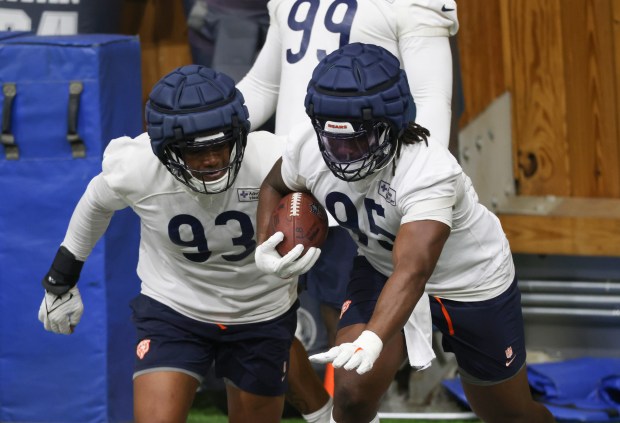 Xavier Carlton (93) and Shemar Turner (95) work out during the Bears organized team activities in the Walter Payton Center at Halas Hall on May 21, 2025, in Lake Forest. (John J. Kim/Chicago Tribune)