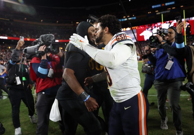 Bears quarterback Caleb Williams, right, congratulates Commanders quarterback Jayden Daniels on an 18-15 win at Northwest Stadium on Oct. 27, 2024, in Landover, Md. (John J. Kim/Chicago Tribune)
