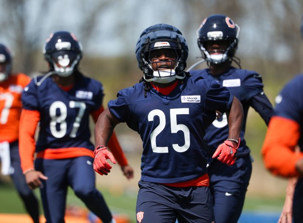 Running back Kyle Monangai (25) warms up during Bears rookie minicamp at Halas Hall on May 9, 2025, in Lake Forest. (Stacey Wescott/Chicago Tribune)