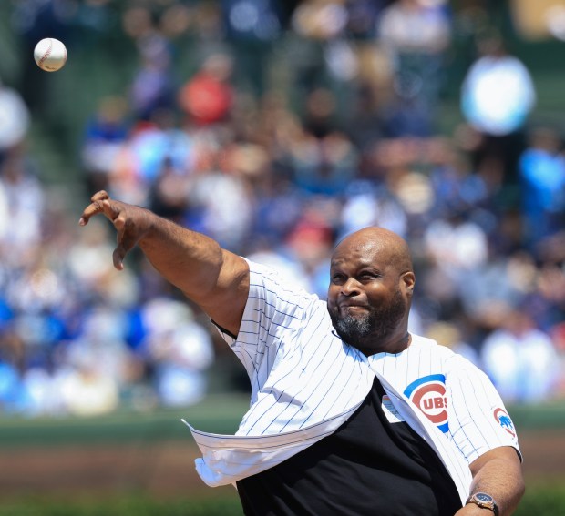 Former NBA player Antoine Walker, a Mount Carmel alumnus, throws a ceremonial first pitch before the Cubs-Reds game on May 31, 2025, at Wrigley Field. (John J. Kim/Chicago Tribune)