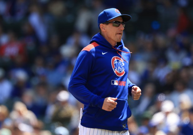 Cubs manager Craig Counsell heads to the dugout after checking on right fielder Kyle Tucker, who was hit by a pitch, in the first inning against the Reds on May 31, 2025, at Wrigley Field. (John J. Kim/Chicago Tribune)