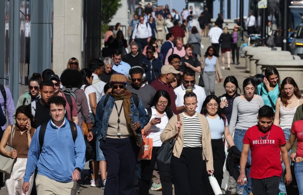 People cross North Michigan Avenue at East Randolph Street on May 13, 2025, in Chicago. Chicago's population grew by about 22,000 people since the 2023 according to census data. (John J. Kim/Chicago Tribune)