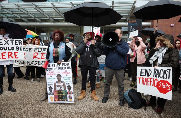 A rally in memory of Dexter Reed takes place outside Chicago police headquarters on April 18, 2024, in Chicago. A week later, Reed's family filed a lawsuit against the City of Chicago and Chicago Police Department officers who fatally shot Reed during a traffic stop in Humboldt Park. Chicago's City Council shot down a proposed settlement with Reed's family. (John J. Kim/Chicago Tribune)