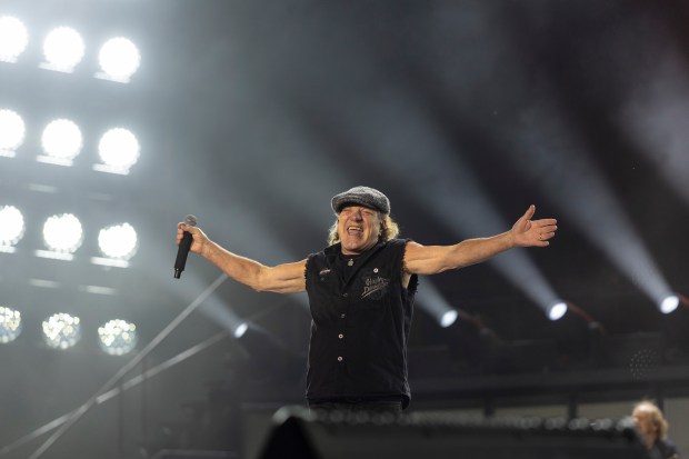 AC/DC lead vocalist Brian Johnson greets the crowd as he steps on stage at Soldier Field on Saturday, May 24, 2025, in Chicago. (Vincent D. Johnson/for the Chicago Tribune)