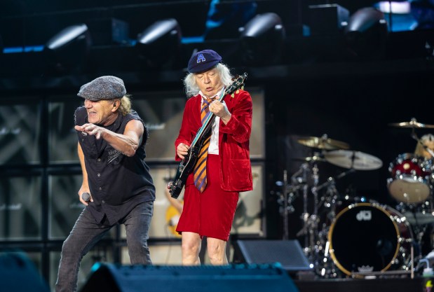 Brian Johnson, left, and Angus Young of AC/DC during the band's "Power Up" tour at Soldier Field on May 24, 2025. (Vincent D. Johnson/for the Chicago Tribune)