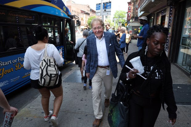 James Downey, center, who wrote for over 30 seasons of Saturday Night Live, walks to a subway in Brooklyn, NY, to visit the show's studio in Manhattan on Saturday, May 3, 2025. (Terrence Antonio James/Chicago Tribune)