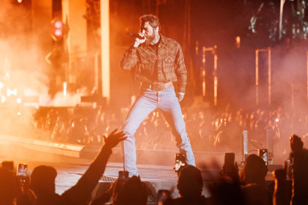 Post Malone performs at Wrigley Field for the first time, May 22, 2025, in Chicago. (Armando L. Sanchez/Chicago Tribune)