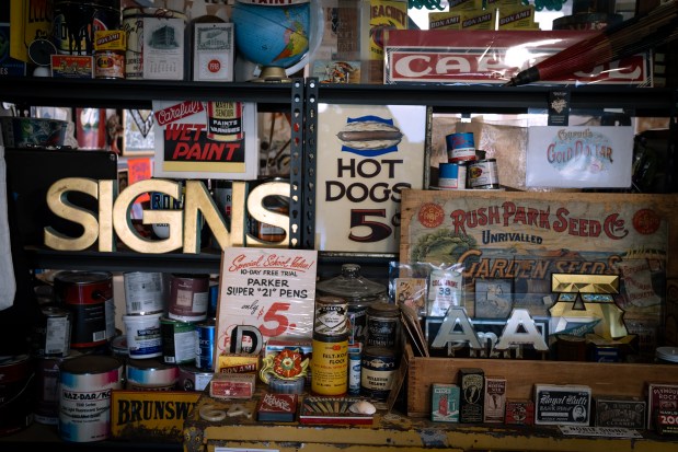 Signs and ephemera in the collection of Kelsey and Andrew McClellan, in their Heart & Bone Sign studio, May 5, 2025. (E. Jason Wambsgans/Chicago Tribune)