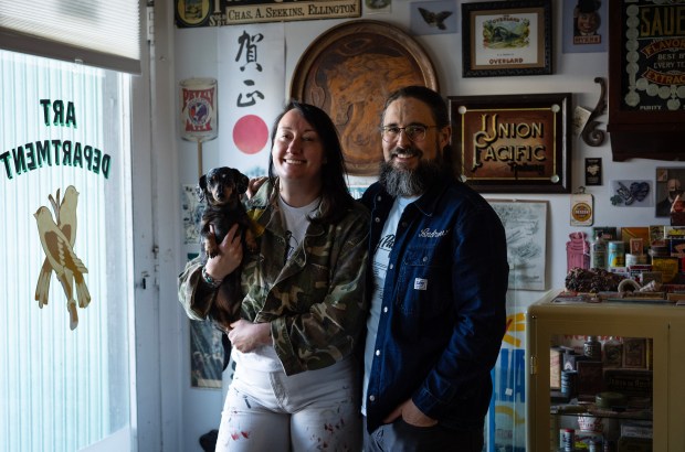 Kelsey and Andrew McClellan, of Heart & Bone Sign, a traditional sign-painting and gold-leafing company in Chicago. (E. Jason Wambsgans/Chicago Tribune)