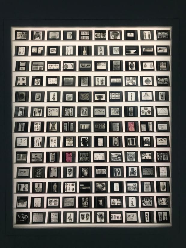 A display of glass lantern slides at the Theaster Gates exhibit at the Walker Arts Center in Minneapolis in 2019. The slides, which had been part of an art class at the University of Chicago and set to be discarded, were recovered by Gates and contextualized into a bigger conversation about race and art history. (Bobby Rogers, provided by the Walker Art Center)