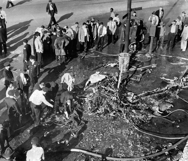 The scene at Milwaukee Avenue and Hubbard Street where the WGN helicopter crashed and exploded killing Officer Leonard Baldy and pilot George Ferry on May 2, 1960. (Chicago Tribune historical photo)