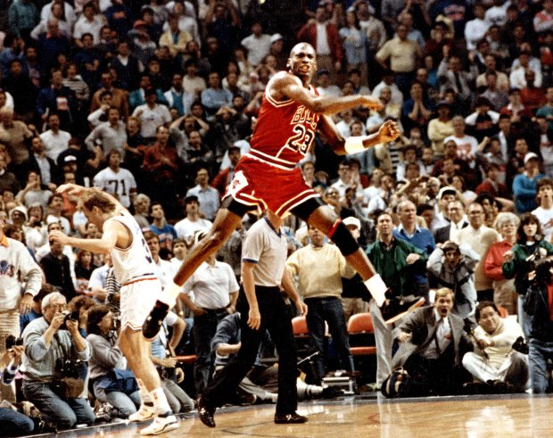 Michael Jordan reacts after hitting the game-winning basket over Cleveland's Craig Ehlo, left, in Game 5 of the NBA playoffs on May 7, 1989, in Cleveland. (Ed Wagner Jr./Chicago Tribune)