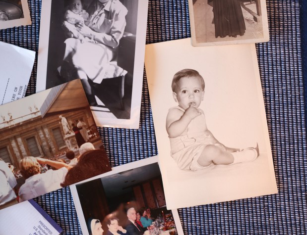 Undated childhood photographs of new Pope Leo XIV are laid out on a kitchen table at the home of his brother, John Prevost, on May 8, 2025, in New Lenox. (John J. Kim/Chicago Tribune)