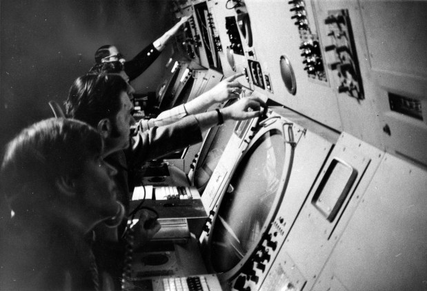 FAA crews work in the basement control room of the new air traffic control tower at O'Hare International Airport on April 26, 1971. This space is 1,500 square feet, three times bigger than the old tower. Here, controllers monitor Automated Radar Terminal System (ARTS) 111. This automated radar equipment transmits information from planes to computers to consoles. (James O'Leary/Chicago Tribune)